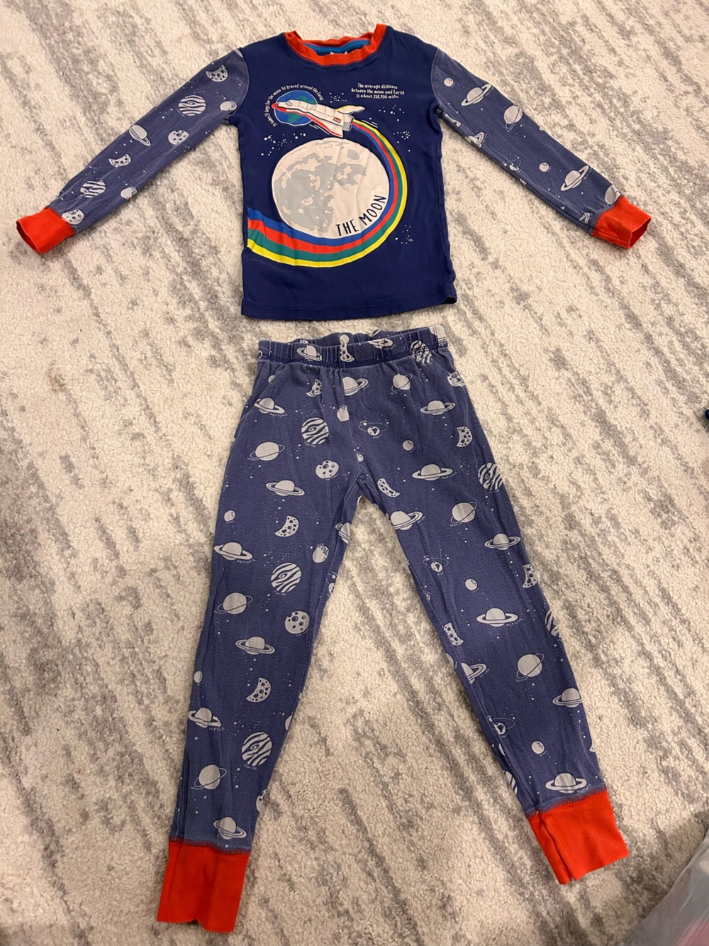 Mini Boden Navy Space Rocket Pajama Set with Red Cuffs and Rainbow Detail